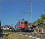 Starting from Ligerz, the SBB Re 6/6 11669-5 is on its way as a locomotive train heading towards Biel/Bienne. Just behind me, the construction site for the new double-track bypass tunnel begins.

July 11, 2025