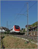 Departing Ligerz, on the last single-track section of the Jura foot line, an SBB RABe 500 ICN as IC 5 is on its way towards Biel/Bienne.