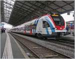 The Léman Express RABe 522 220 and 216 in Lausanne.