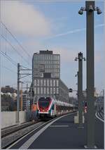 The SBB CFF LEX RABe 522 228  Léman Express  to Annemasse by his stop in Lancy Pont Rouge.