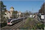 Two SBBB RABe 523 (FLIRT) on the way to Lausanne by the Castle of Chillon.