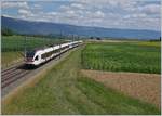 The SBB Flirts RABe 523 059 and 027 on the way from Villeneuve to Vallorbe by Arnex.