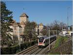 A SBB RABe 523 on the way to Villeneuve by the Castle of Chillon.