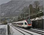 The SBB RABe 523 028 on the way to Aigle by Villeneuve.

25.01.2021