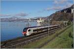 The SBB FLIRT3 RABe 523 104 by Villeneuve on the way to Lausanne. 

10.01.2022 