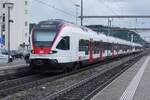 SBB 523 041 quits Pratteln in urban service to Basel SBB on a grey 14 May 2026.