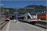 The Trenord ETR 524 203 (RABe 524 203) on the way to Como and in the Background det SBB TILO RABe 524 204 in Mendriso. 

25.09.2019