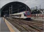 The SBB TILO RABe 523 114 on the way to Locarno is leaving the Milano Centrale Station.