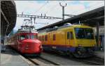 Wait in Vevey his departur times: The RAe 4/8 1021  Churchill  and the  Train des Vignes  (Vineyard train).