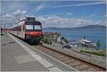 A Region Alpes RBDe 560  Domino  to Brig is waiting his departur in St Gingolph.
On the lake the steamer  Italie  on the way to Vevey. 

 30.07.2022