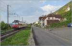 An SBB RBDe 560 Domino is operating as R13 on its way from Yverdon les Bains to Biel/Bienne. I photographed the train on the last single-track section of the Jura Foot Line between Ligerz (in the background) with the well-known church on the right in ...