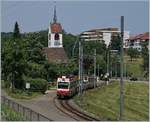 The WB BDe 4/4 16 on the way to Liestal by the St Petr Church near Oberdorf Winkelweg.