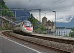 A SBB ETR 610 on the way to Geneva by the Castle of Chillon.
