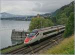 A SBB ETR 610 on the way to Geneva by the Castle of Chillon.