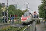 An SBB RABe 503 (ETR 610) is running as an EC from Zurich to Munich and reaches Bregenz Hafen station in rather nasty weather, where the train of course passes through without stopping. 

14 Sept. 2024