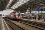 A SBB RABe 502 is a IC1 from St Gallen to Geneva and this service is arrriving at Lausanne.