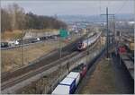 During the SBB RABDe 502 009-9  Stadt St.Gallen and an other one aare on the way to Geneva Airport, leavs a Cargo service the Lausanne Triage Station.