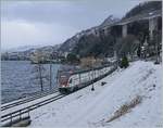 There is not very often snow on the laksite by Villenveuve: The SBB RABe 511 036 on the way to St Maurice.