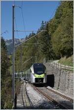 The BLS RABe 528 12 MIKA has left the Bunschenbach Bridge and reaches the Weissenburg stop on its journey from Zweisimmen to Bern.