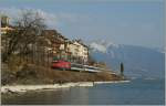 By St Saphorin, on the sea site of the Lake of Geneva runs a SBB Re 460 with his IR to Lausanne.
25.03.2012