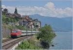 A SBB Re 460 wiht an IR 90 on the way to Brig by St-Saphorin.