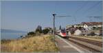Un SBB RABe 503 (oficiosamente:) Pinocho ( réplica en forma de tornillo  del ETR 610) viaja como EC 40 desde Milano Centrale a Lausana y está pasando por la estación de Rivaz.

12 de agosto de 2026