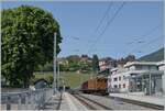 The RhB Bernina Bahn Ge 4/4 N° 81 by the Blonay-Chamby Railway is arriving wiht his  Riviera Belle Epoque  Service from Chauin to Vevey in St-Légier. 

28.05.2023