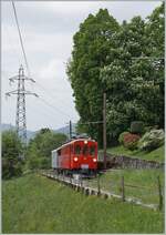 Shortly before Chaulin, the ABe 4/4 I No. 35 of the Blonay Chamby Railway is on its way towards Chamby with a passenger coach.

May 3, 2025