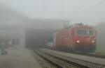 The Glacier Express in the Fog on the Oberalp Passhhe on 2004 meters over sea-level.