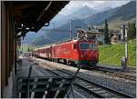 The MGB HGe 4/4 11 is arriving with his local service from Andermatt to Disentis at the Serdrun Station.