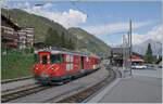 The MGB Deh 4/4 23 with a local train to Andermatt by his stop in Sedrun.