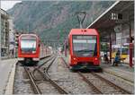 The MGB ABDeh 4/8 2023  Komet  and the two MGB ABeh 4/12 806 and 809  Orion  await their departure to Fiesch and Zermatt, respectively, in Brig MGB.