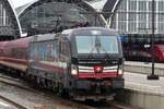 After running round, SBBCI 193 701 stands with the empty stock of the TUI Ski-Express at Amsterdam Centraal on 22 January 2023.