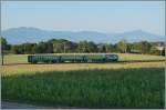 The BAM Ge 4/4 22 with the local train 105 near Vufflens-le-Château.