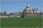 Two BAM MBC SURF Be 4/4 with their middle car are on the way from Morges as regional train 125 in front of Vufflens le Château. In the background and not to be overlooked is the castle of Vufflens. 

April 5, 2023