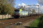 Tank train with BLS 475 408 at the reins speeds through Hulten on 4 November 2020.