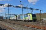 On a glorious 13 February 2024 BLS 485 018 hauls an LKW Walter intermodal train through Pratteln.