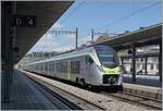 The BLS RABe 528 119  Citt di Domodossola  on the way from Bern to birg by his stop in Spiez.