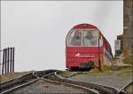 . A BRB train is disappearing in the fog in Rothorn Kulm on September 29th, 2013.