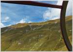 . The superb BRB track with the Schonegg galerie and the summit station Rothorn Kulm seen out of the running train on September 27th, 2013.