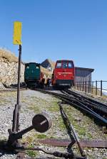 Rothorn Kulm mountain station (2244 m above sea level)on 01.10.2011. Left the coal-fired locomotive BRB 6, right the diesel BRB 9 and behind the heating oil-fired locomotive BRB 16, all are standing at the mountain station. Everywhere enthroned the Rothorn summit.