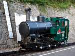 The heating oil-fired locomotive travels BRB 15 on 30.09.2011 (18:45 h) in the station Brienz (BRB).