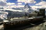 Two Bhe 2/4 No 3011 (discarded 2009) and annother at Gornergrat station; in the background the Matterhorn, August 22nd, 1979.