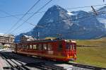 Standing ready BDhe 2 / 4 railcar No. 209 with control trailer Bt 33 of the Jungfrau Railway on 02.10.2011 at the station Kleine Scheidegg (2064 m above sea level). In the background the famous Eiger North Face.