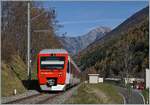 The TMR Region Alps RABe 525 041 (UIC 94 85 7525 041-0 CH-RA) on the way to Sembrancher near  Orsières. 

10.11.2020