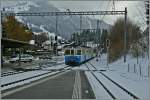 The MOB ABDe 8/8 is arriving with his train 2221 from Zweisimmen to Montreux at Gstaad.