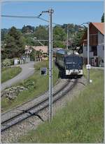 The MOB Ge 4/4 6005 with a MOB Panoramic Express on the way to Zweisimmen by Planchamp.