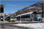 The MOB ABt 344 - Be 4/4 5004 - Bt 244 (->  Lenkerpendel ) in Lenk im Simmental.
In the background MOB Panoramic wagons and the ABDe 8/8 4004  Fribourg 
 25.01.2022