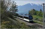 A CEV MVR ABeh 2/6 is the local service from Montreux to Cherney by Planchamp with vieu on the Castle of Châtelard and the Alps.