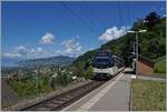 Picture with a view: While the CEV MVR ABeh 2/6 7503  Blonay-Chamby  reaches the Sonzier station as a regional train from Montreux to Les Avants, the view on the left glides far over the Riviera Vaudoise and the Lavaux. 

May 28, 2024